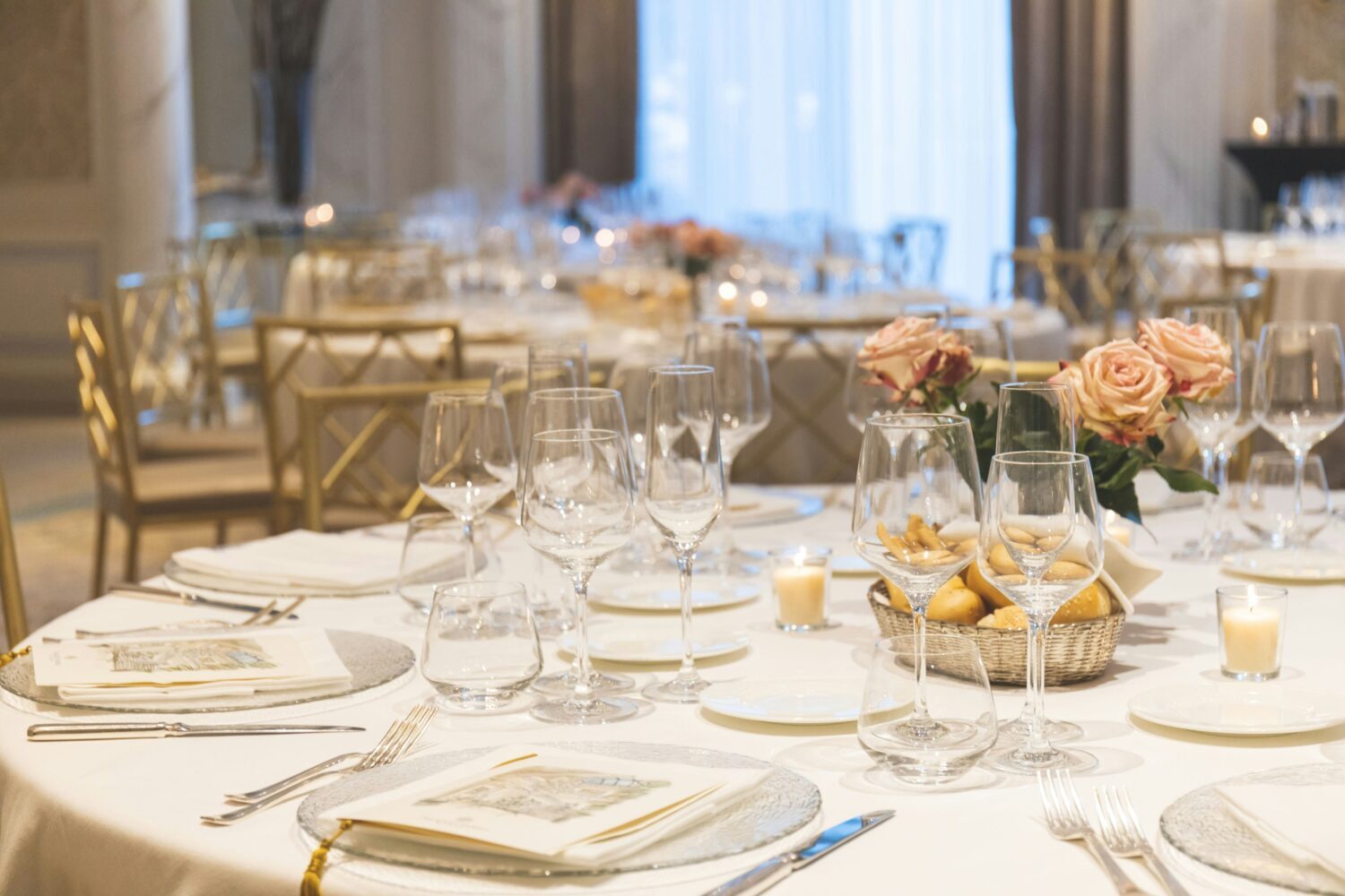 a gala table with a pretty rose centerpiece