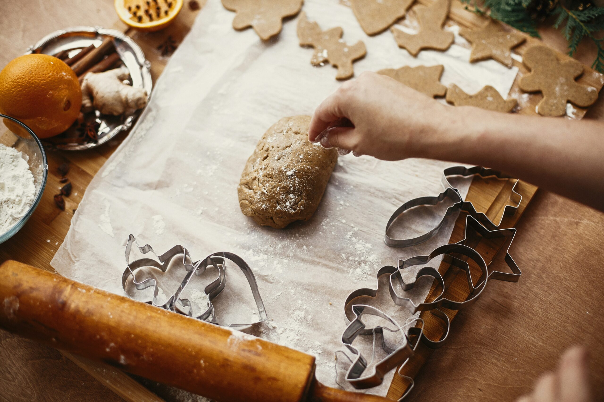 Winter fundraising ideas – cookie making workshop a person makes gingerbread cookies at a winter fundraising workshop